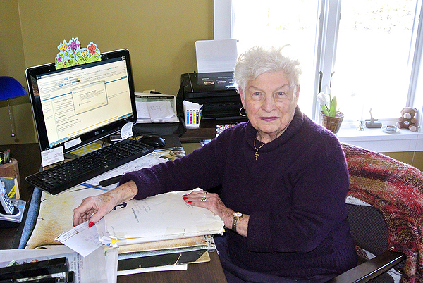Travel agent Nina Kraus at work in her home office.  DANA SHAW