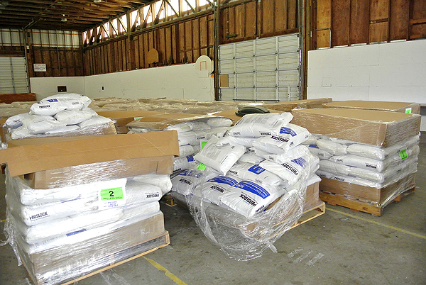 Pallets of Phoslock were dropped off Monday and Tuesday to be used to treat Mill Pond.   DANA SHAW