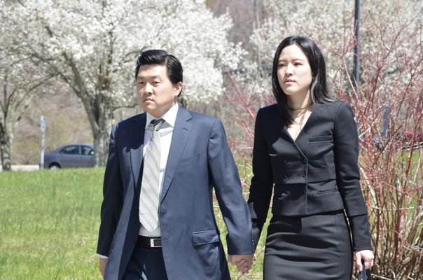 Jason Lee and his wife walk to court on Wednesday afternoon to hear the judge's verdict. SHAYE WEAVER