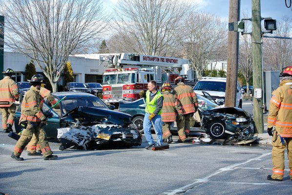 Emergency personnel respond to the scene of a two car crash on Hampton Road in Southampton on tuesday afternoon.   DANA SHAW
