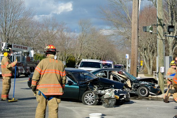 Emergency personnel respond to the scene of a two car crash on Hampton Road in Southampton on tuesday afternoon.   DANA SHAW