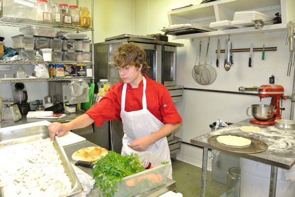 Andy Mosolino in the kitchen at the Deli Counter in Southampton.  DANA SHAW