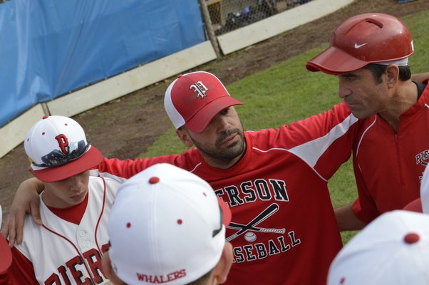 Pierson manager Jon Tortorella speaks to his players after the 7-2 loss in the state final. Morley Quatroche III