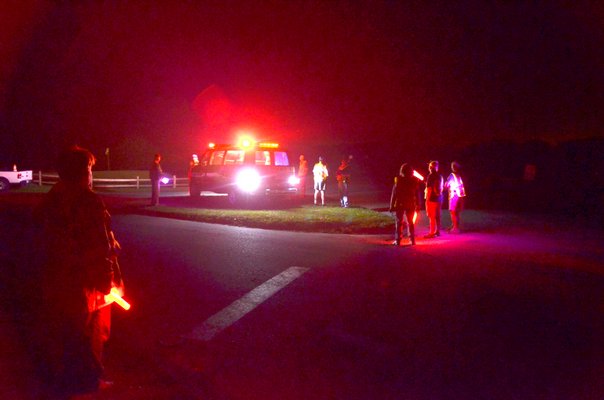 Fire police blocked the entrance of Highway Behind the Pond so that emergency crews could get to the fire on East Dune Lane. Firefighters got the flame down in about 20 minutes. SHAYE WEAVER