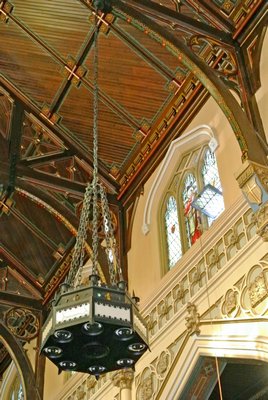Father Mike Vetrano sits in the pews that are to be refinished as part of the In Nomine Domini Fund at the Basilica of the Sacred Hearts of Jesus and Mary.  DANA SHAW
