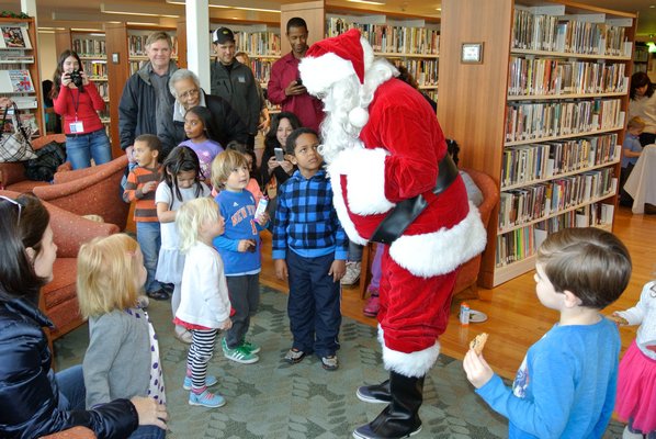 Santa is greeted by his fans at the Hampton Library.