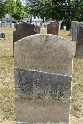 One of the repaired headstones in the North End Graveyard and Burial Ground in Southampton Village.  DANA SHAW