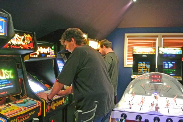 Gamers enjoy Joh Bennetts' arcade filled with old-school games. DANA SHAW