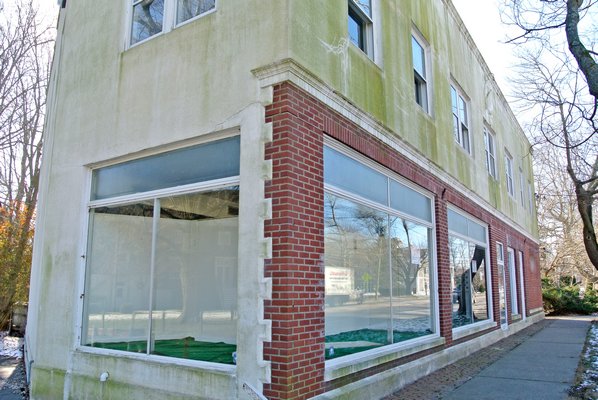 The Bridgehampton Fire District plans to demolish the former Pulver Gas building on Montauk Highway next door to its firehouse by February.  DANA SHAW