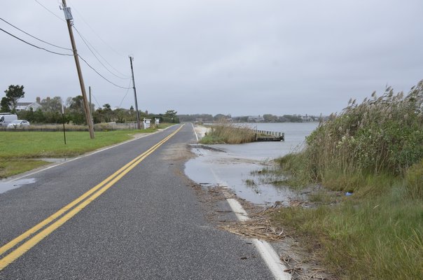 Flooding along Flying Point Road is common when the Southampton Town Trustees cannot open the Mecox Cut. GREG WEHNER