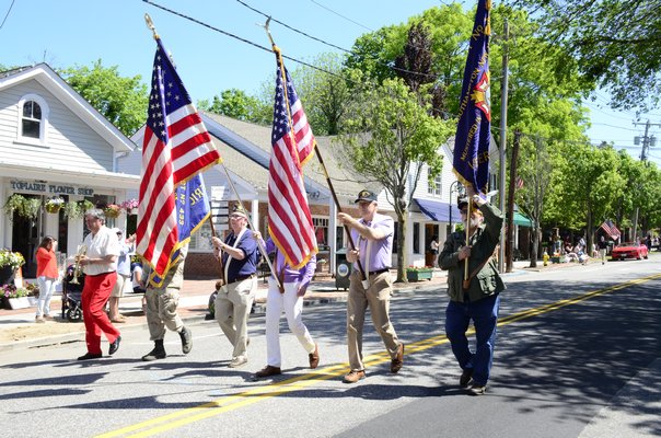 Southampton VIllage Trustees Richard Yastrzemski and Kimberly Allan marched alongside Village Mayor Michael Irving in the Memorial Day Parade on Monday morning. GREG WEHNER