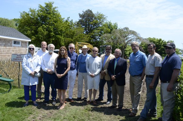 Southampton Village Board members and members of the Lake Agawam Conservation Association watched as a new alternative on-site water treatment system was installed in Agawam Park near a new men's restroom. From left to right: Nancy McGann