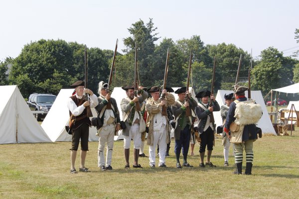 The New York Third Regiment Re-Enactors recreate a military campsite from the Revolutionary War on Westhampton Beach's Great Lawn. KATE RIGA