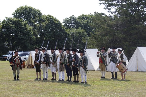 The New York Third Regiment Re-Enactors recreate a military campsite from the Revolutionary War on Westhampton Beach's Great Lawn. KATE RIGA