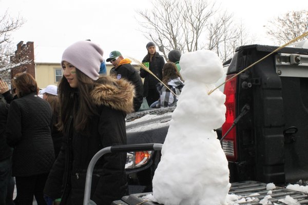 Snowy conditions didn't slow down tailgaters during the 11th annual Hampton Bays St. Patrick's Day Parade on Saturday morning. KYLE CAMPBELL