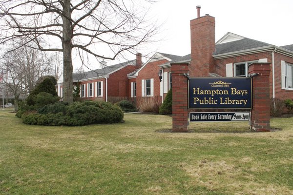 The Hampton Bays Library Board is seeking an at least $1 million bond issue to cover the costs of making upgrades to the library on Ponquogue Avenue. KYLE CAMPBELL