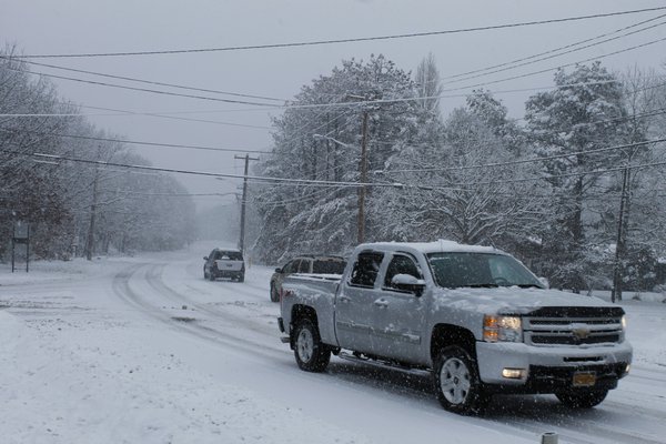 Cars drive on Old Riverhead Road in Hampton Bays on Monday afternoon. KYLE CAMPBELL