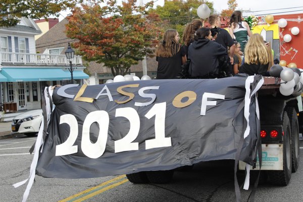  participate in their district’s annual homecoming parade on Friday afternoon. KATE RIGA PHOTOS