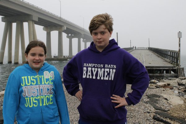 Mary Reister and David Reister stand by the old Ponquogue Bridge in Hampton Bays on Friday afternoon. KYLE CAMPBELL