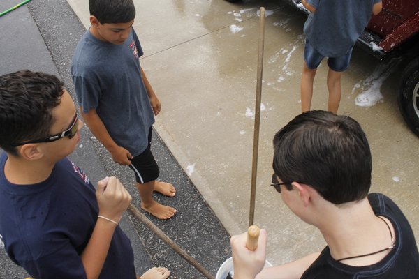 Members of the Eastport Fire Junior Department washed cars at the Eastport Firehouse on Union Avenue as part of a fundraiser on Sunday morning. KYLE CAMPBELL