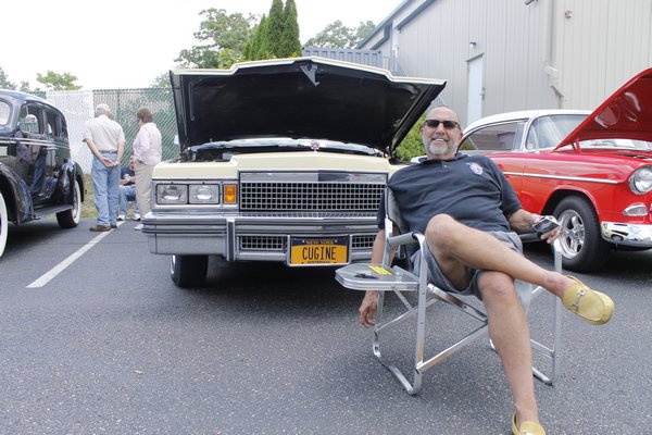 West Babylon resident Dominic Figurito with his 1979 Cadillac Coupe DeVille during the Hampton Bays Fire Department Car Show on Saturday afternoon. KYLE CAMPBELL