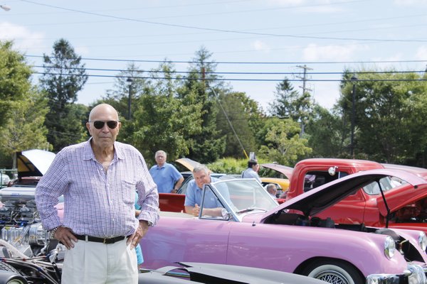 Stan Listokin of Sag Harbor checks out classic rides during the Hampton Bays Fire Department Car Show on Saturday afternoon. KYLE CAMPBELL