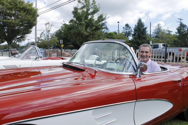 East Quogue resident Joe Gilbert sits in his 1961 Chevrolet Corvette 