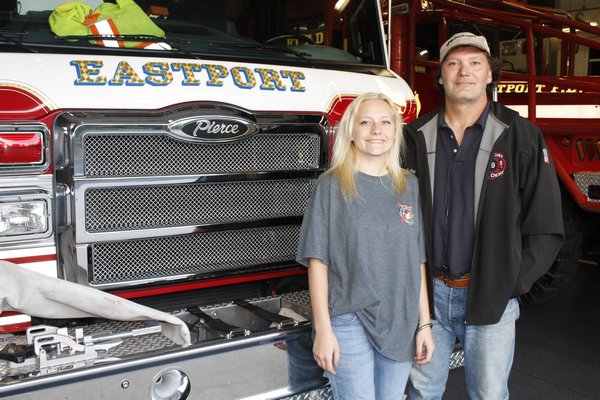 Virginia Massey and her father Kurt Massey inside the Eastport Firehouse on Monday night. KYLE CAMPBELL