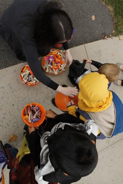 Children collect candy along Mill Road during the Westhampton Beach Halloween parade Friday afternoon. KYLE CAMPBELL