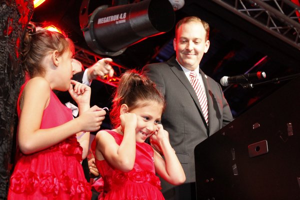 Congressman-elect Lee Zeldin is joined on the Emporium stage by his twin daughters Arianna and Mikayla in Patchogue on Tuesday night. KYLE CAMPBELL