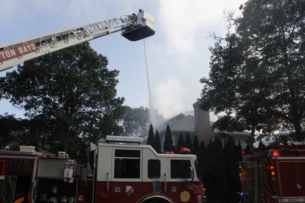 The Hampton Bays Fire Department responded to a house fire on Washington Avenue on Thursday afternoon. KYLE CAMPBELL