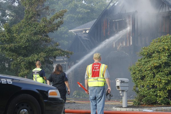 The Hampton Bays Fire Department responded to a house fire on Washington Avenue on Thursday afternoon. KYLE CAMPBELL