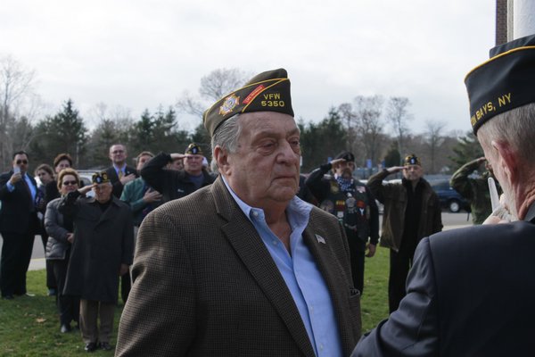  presents Hampton Bays resident Jack Kampf with four medals recognizing his service in the Korean War during the Hampton Bays Elementary School veteran of the month ceremony on Friday. KYLE CAMPBELL