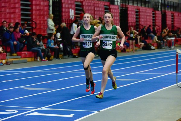 Lady Canes Maeve Murphy and Jenny Jordan run side-by-side in the 1