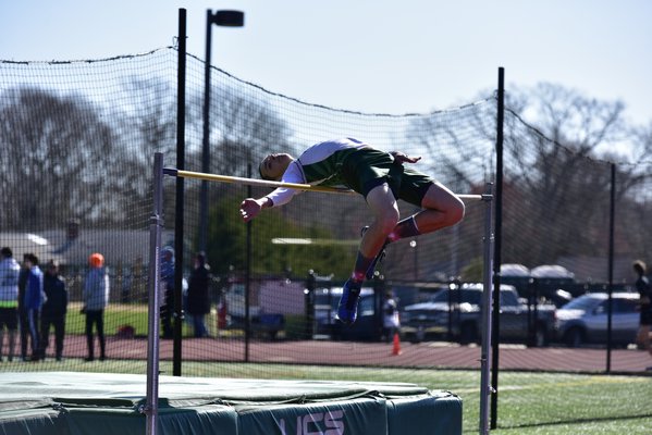 Kyle Terry takes a stab at the high jump for Westhampton Beach. RICCI PARADISO