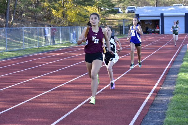 East Hampton's Liana Paradiso runs in the distance medley relay. RICCI PARADISO