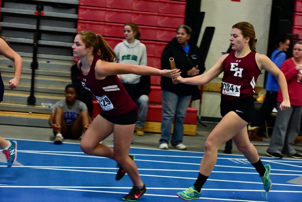 Gabby McKay hands off to Lina Bistrian in the 4x200-meter relay. RICCI PARADISO