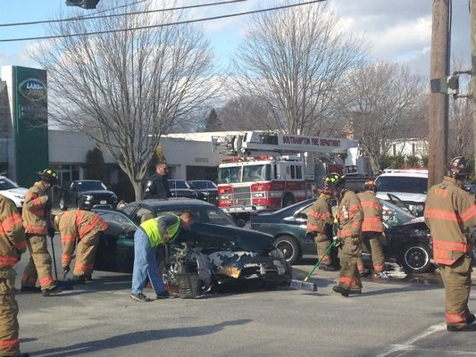 Emergency personnel are on the scene of a car crash on Hampton Road in Southampton. BY DANA SHAW