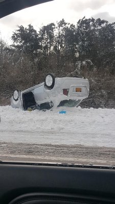 An overturned car on Sunrise Highway in Hamp