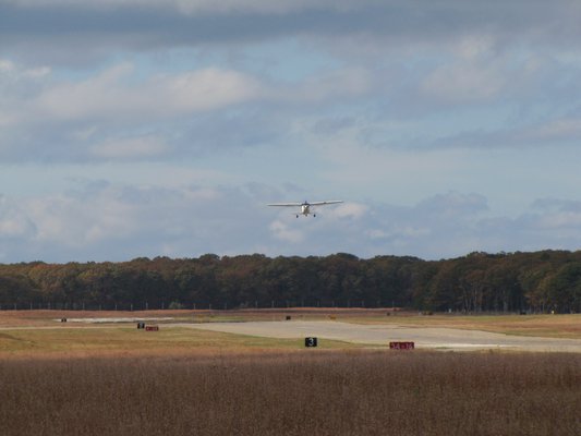 East Hampton Town has been criticized for plans to clear as much as 20 acres of woodlands to meet FAA safety standards for low-visibility landings at East Hampton Airport. MICHAEL WRIGHT