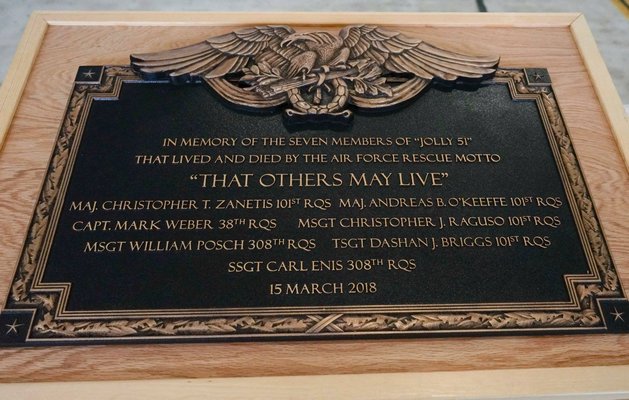 A memorial plaque to honor U.S. Airmen who perished in a helicopter crash in March in Iraq