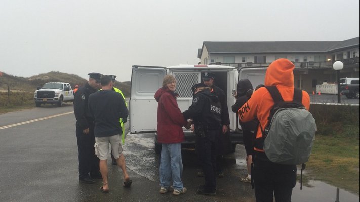 Several protesters were arrested by East Hampton Police Friday morning for forming a human chain to try to stop work on the Montauk shoreline project. MICHAEL WRIGHT