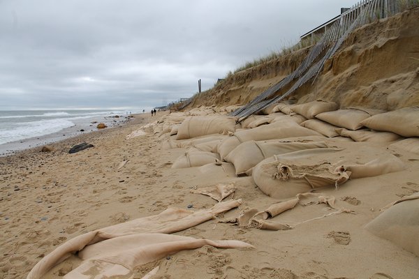 Last month’s strong storm surge uncovered sandbags from a portion of the U.S. Army Corps’ Downtown Montauk Emergency Stabilization Project. KYRIL BROMLEY