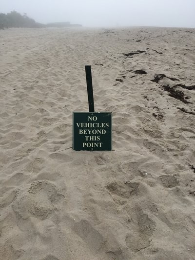 A sign informing beachgoers of the new restriction imposed by the Georgica Association.