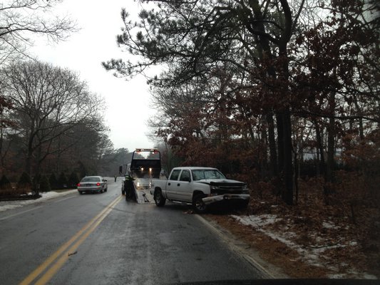 A truck slid off road on Bellows Pond Road in Hampton Bays on Friday morning. Multiple motor vehicle accidents occurred in the hamlet Friday because of ice on the roads. DANA SHAW