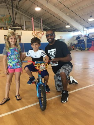  a teacher at Hayground School who teaches young children how to ride a bike. COURTESY TRAVIS FOREMAN