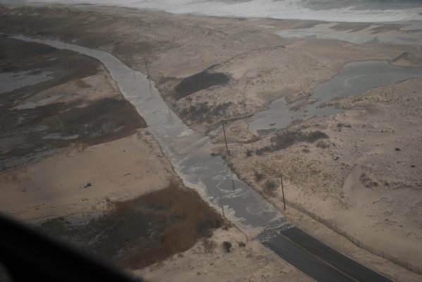 The ocean washed through the anemic dunes east of Tiana Beach in Hampton Bays back on April 26. Suffolk County Police Department