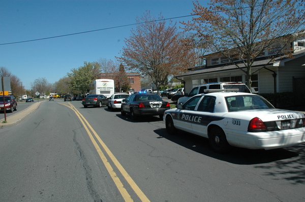 East Hampton Village and Southampton Town Police car arrived at the East Hampton Village train station as the bus pulled up. STEPHEN A. KOTZ
