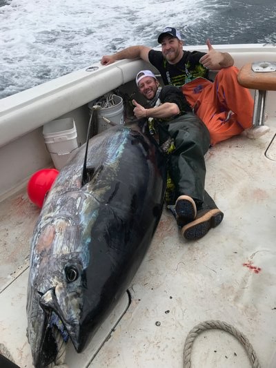 Billy Altman and Paul Vinsentin of Hampton Bays celebrated landing this giant bluefin tuna off North Carolina last month aboard the Oakland's Marina-based boat Reel E Buggin.