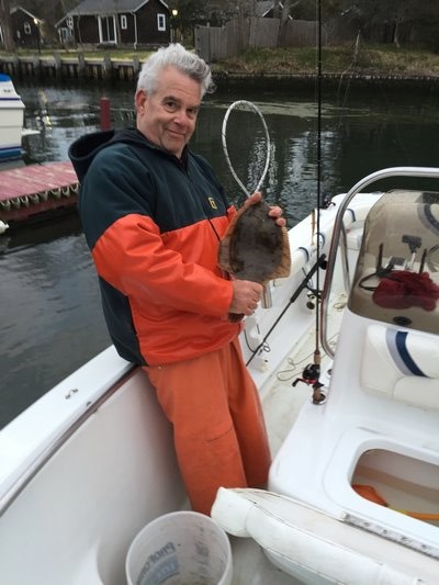 Desi Menendez with a rare keeper flounder caught from the Quogue Canal last weekend. Mike Stern